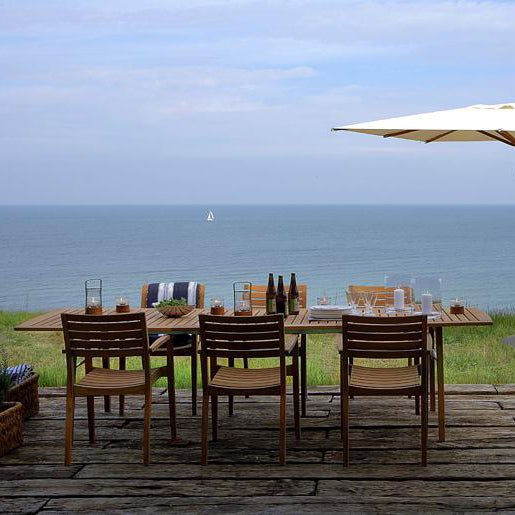 Ballare Table by Skagerak, showing ballare table with chairs in live shot.
