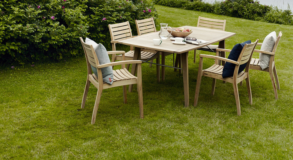 Ballare Table by Skagerak, showing ballare table with chairs in live shot.