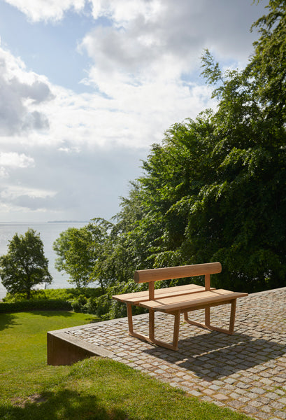 Banco Outdoor Bench by Skagerak, showing banco outdoor bench in live shot.