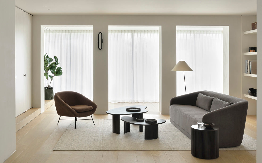 Barrow Lounge Chair by Ethnicraft, showing lounge chair with sofa  in the live shot.