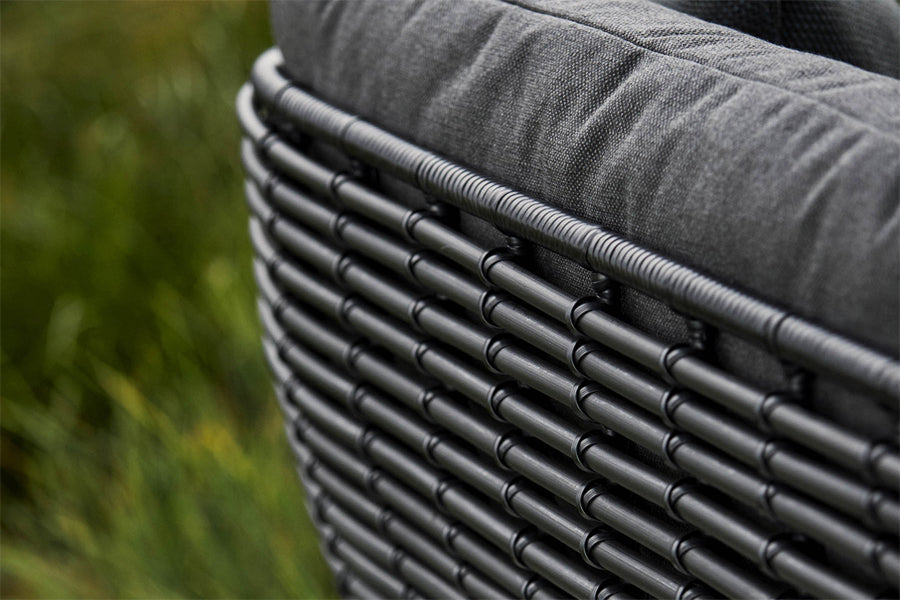 Basket 2-Seater Sofa by Cane-Line, showing closeup view of basket 2-seater sofa in live shot.