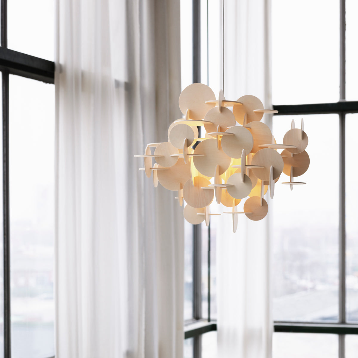 Bau US Pendant Lamp by Normann Copenhagen, showing bau us pendant lamps in live shot.