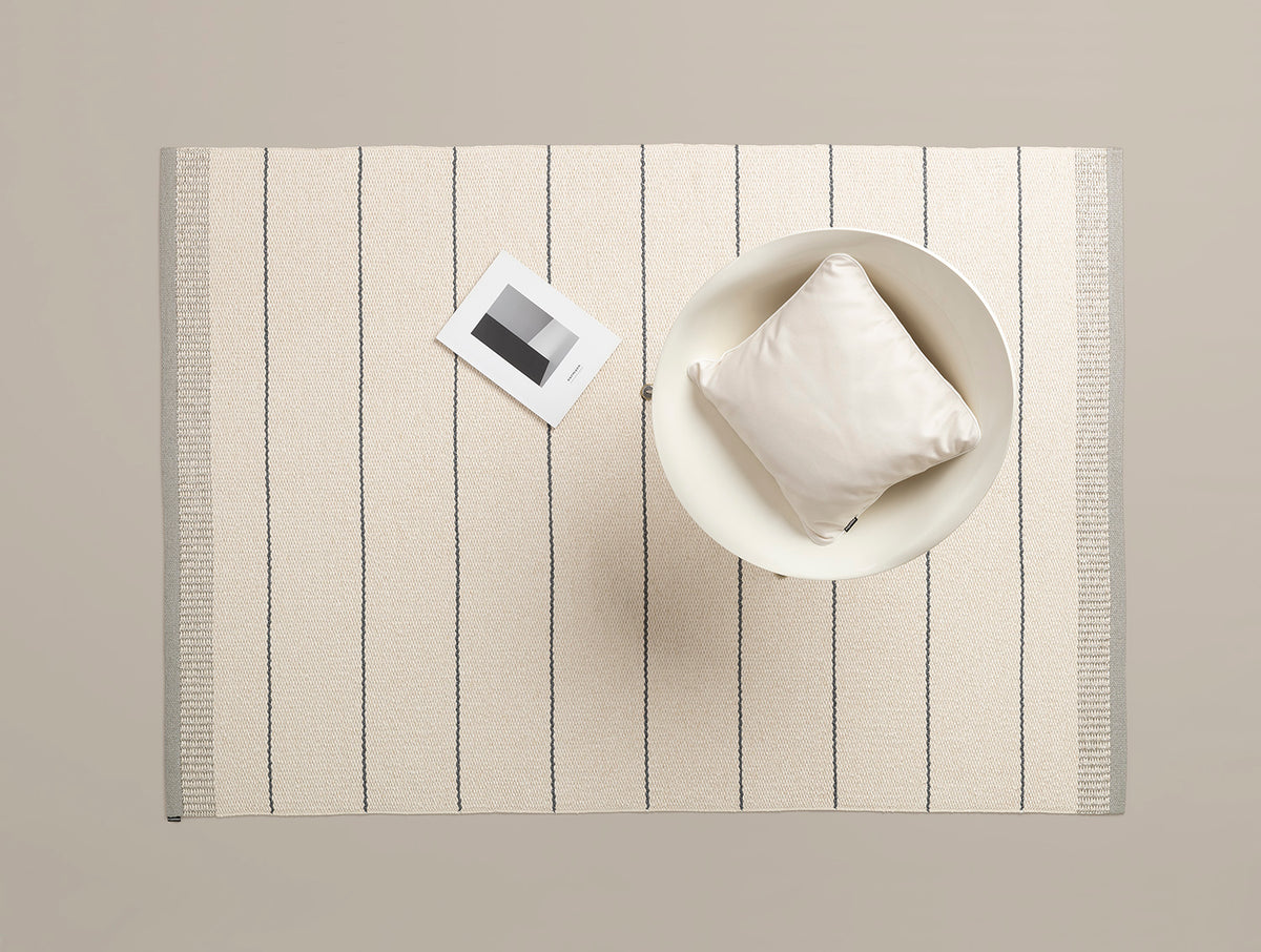 Belle Warm Grey Runner Rug by Pappelina, showing top view of belle warm grey runner rug in studio shot.