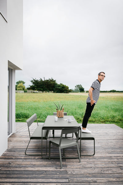 Bellevie Bench by Fermob, showing live shoot of the bench with dining table.