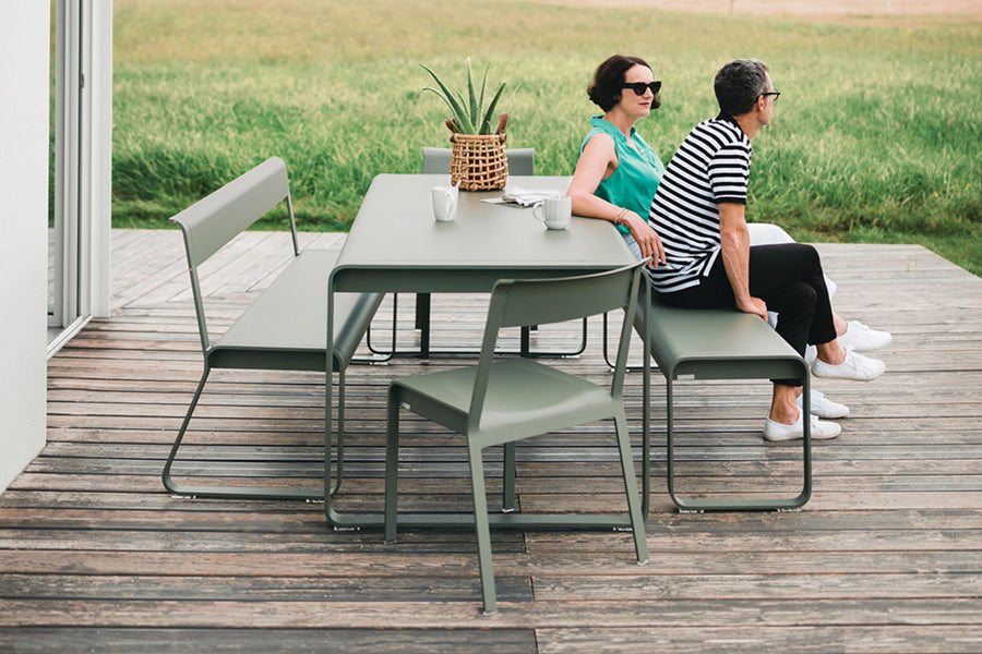 Bellevie Bench with Back by Fermob, showing of bellevie bench with back and table in live shot.
