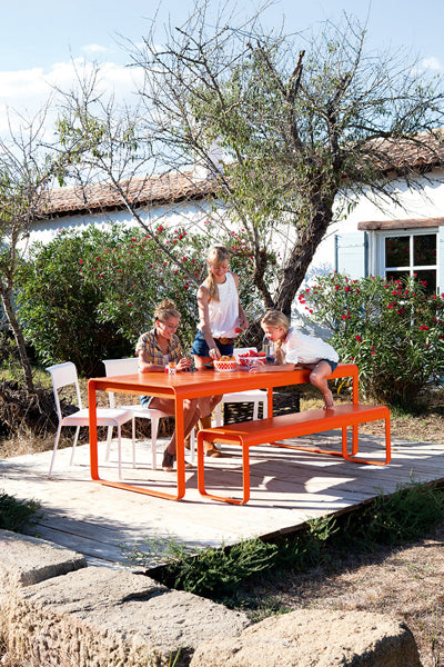 Bellevie Table by Fermob, showing live shoot of the dining table with bench.