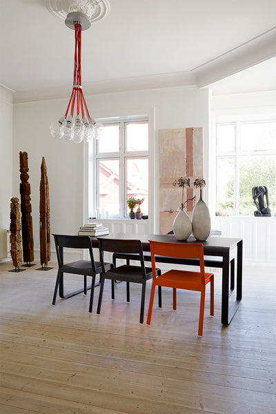 Bellevie Table by Fermob, showing live shoot of the dining table with chair.