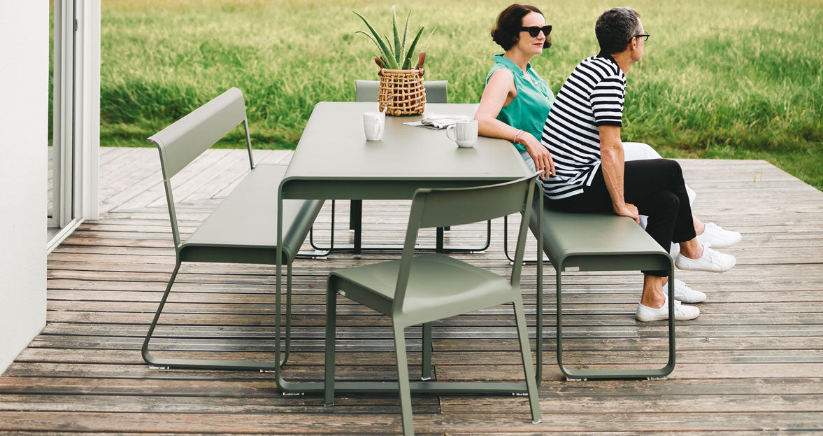 Bellevie Table by Fermob, showing of bellevie table with bench in the live shot.