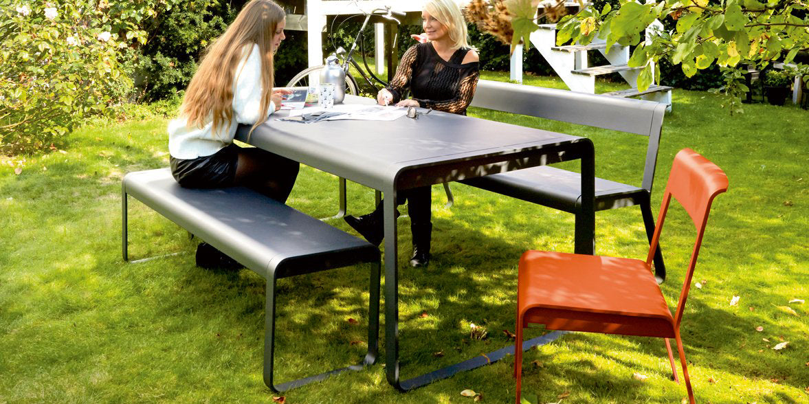 Bellevie Table by Fermob, showing of bellevie table with bench in the live shot.