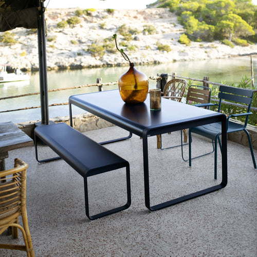 Bellevie Table by Fermob, showing tables with benches in live shot.