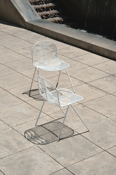 Betty Stacking Chair by Bend, showing betty stacking chairs in live shot.