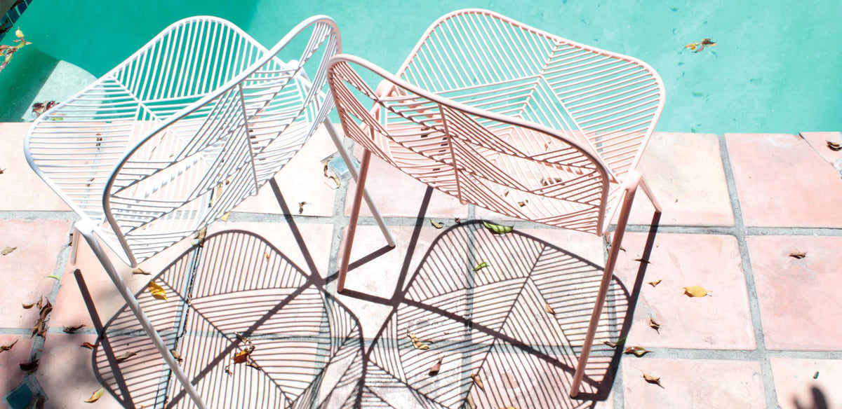 Betty Stacking Chair by Bend, showing two betty stacking chairs in live shot.