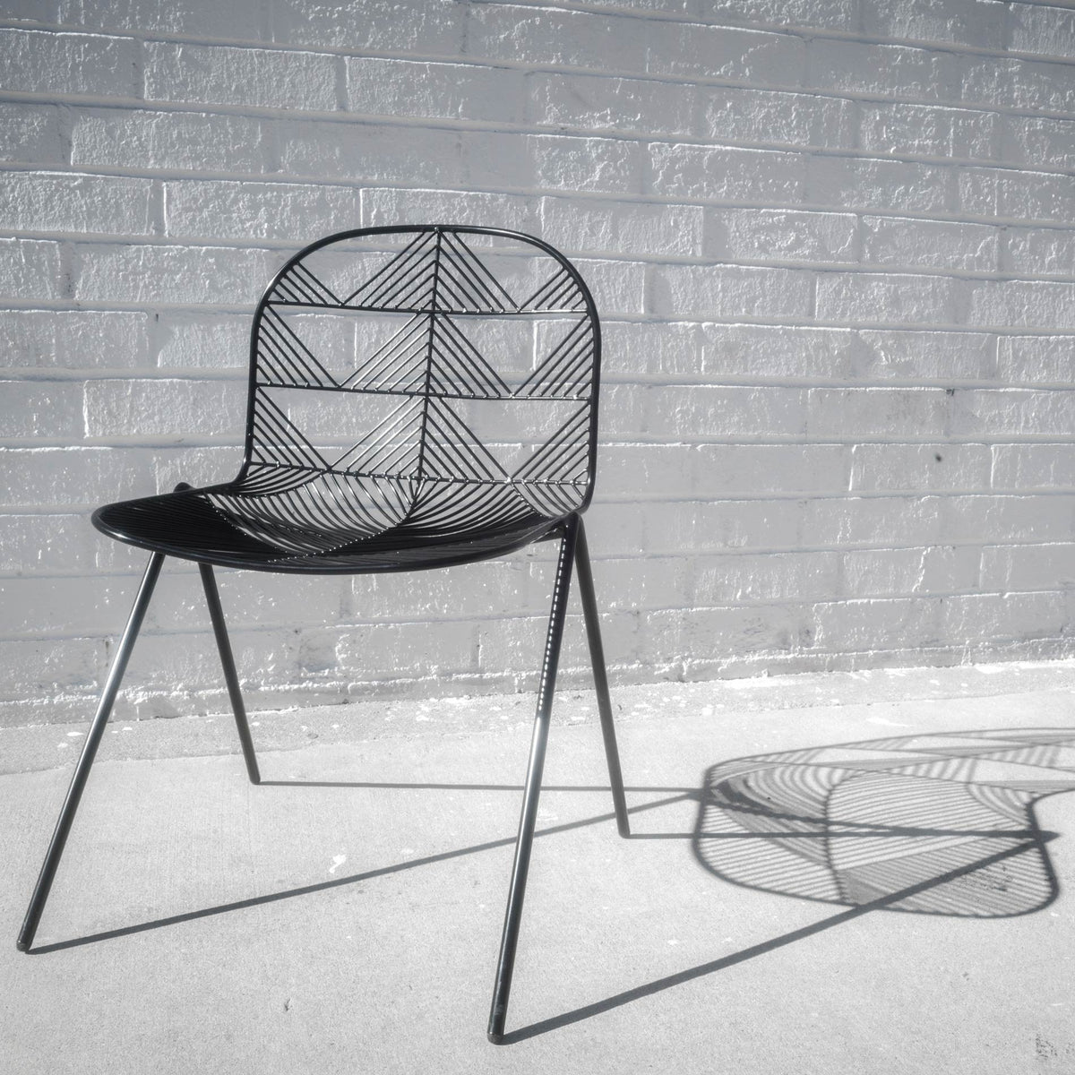 Betty Stacking Chair by Bend, showing betty stacking chair in live shot.