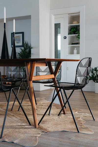 Betty Stacking Chair by Bend, showing betty stacking chairs with table in live shot.