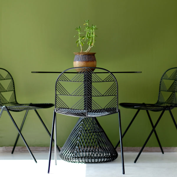 Betty Stacking Chair by Bend, showing betty stacking chairs with table in live shot.