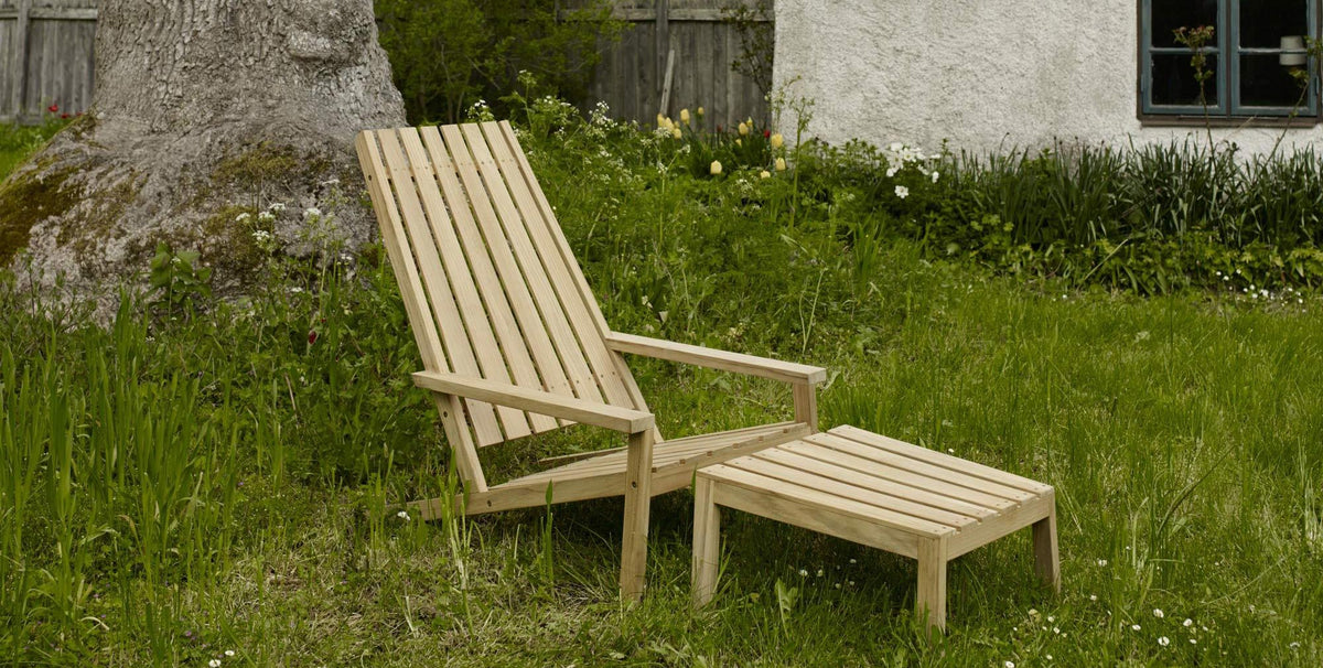 Between Lines Deck Chair by Skagerak, showing between lines deck chair with stool in live shot.
