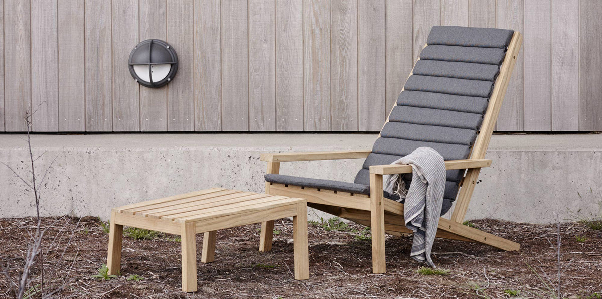 Between Lines Deck Chair by Skagerak, showing between lines deck chair with stool in live shot.