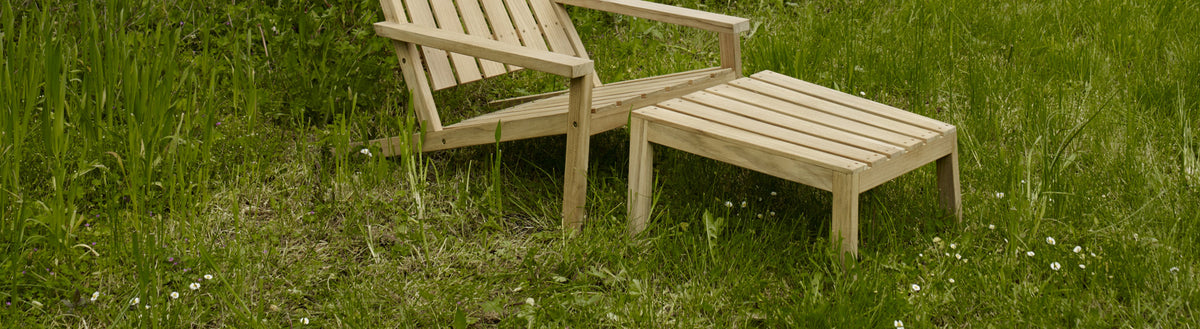 Between Lines Deck Stool by Skagerak, showing between lines deck stool with deck teak chair in live shot.