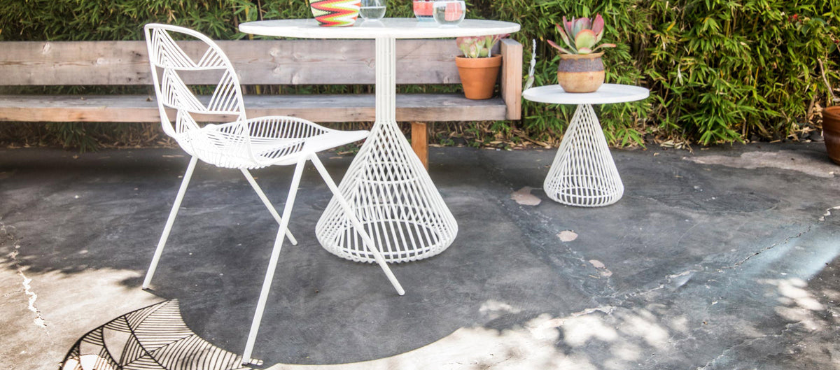 Bistro Base Table by Bend, showing bistro base table with chair & table in live shot.