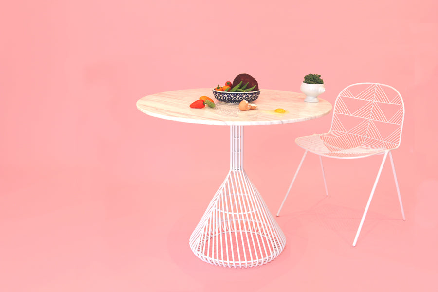 Bistro Base Table by Bend, showing bistro base table with chair in live shot.