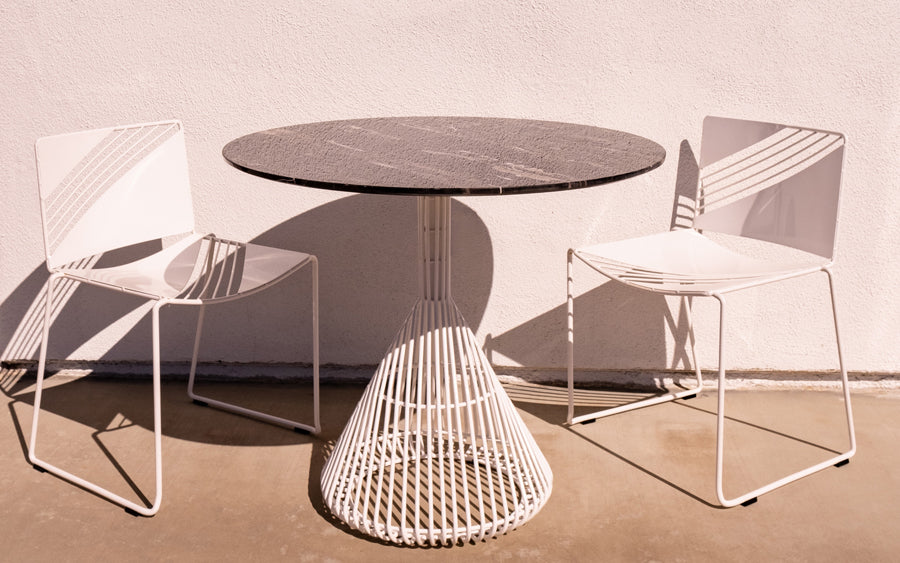 Bistro Base Table by Bend, showing bistro base table with chairs in live shot.