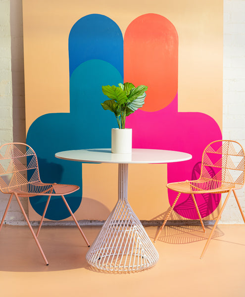 Bistro Base Table by Bend, showing bistro base table with chairs in live shot.