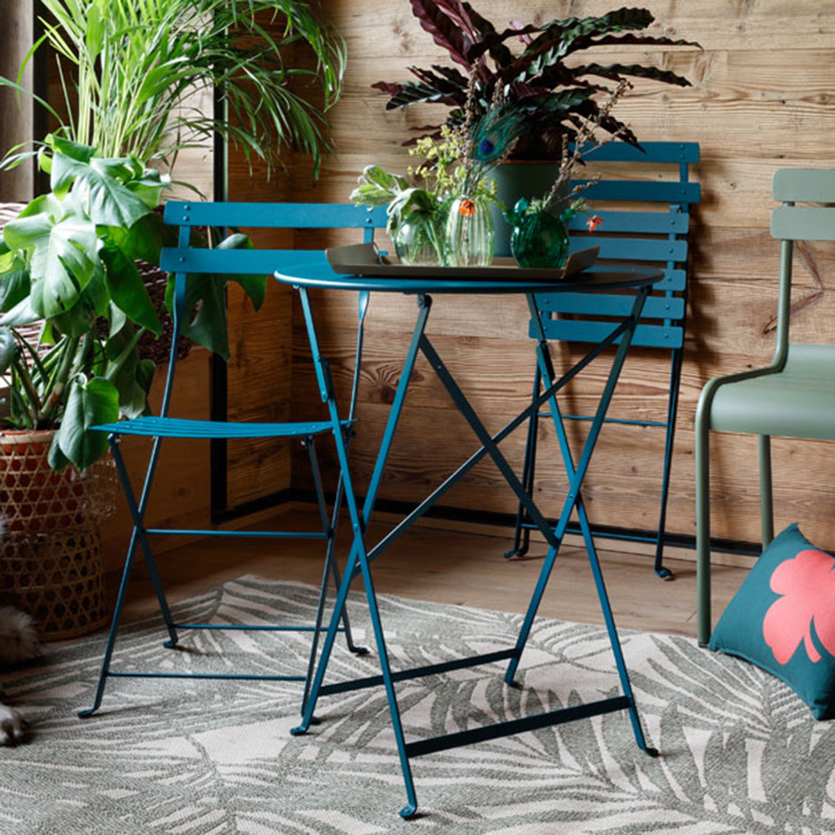 Bistro Metal Chair by Fermob, showing bistro metal chairs with table in live shot.