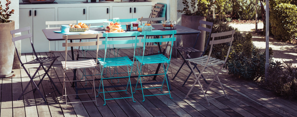 Bistro Metal Chair by Fermob, showing bistro metal chairs with table in live shot.