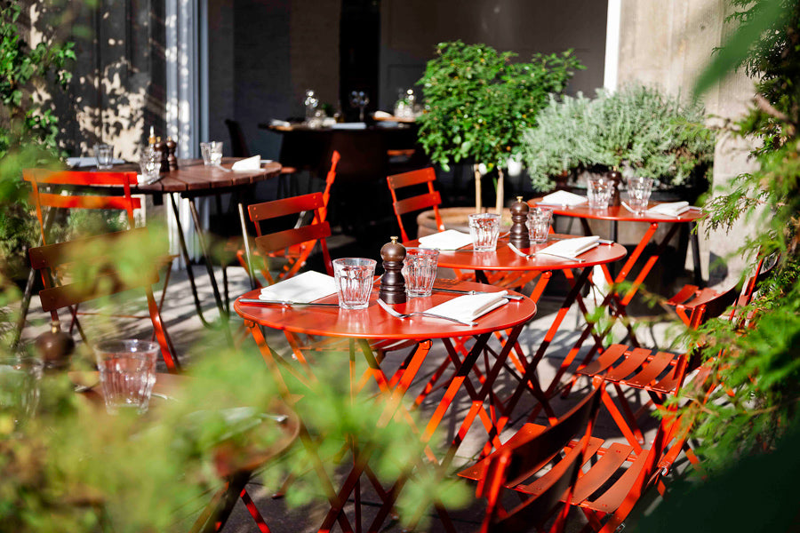 Bistro Round Tables by Fermob, showing live shoot of the table with chairs.