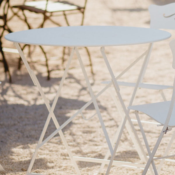 Bistro Round Folding Tables by Fermob, showing closeup view of round folding table 30" in live shot.
