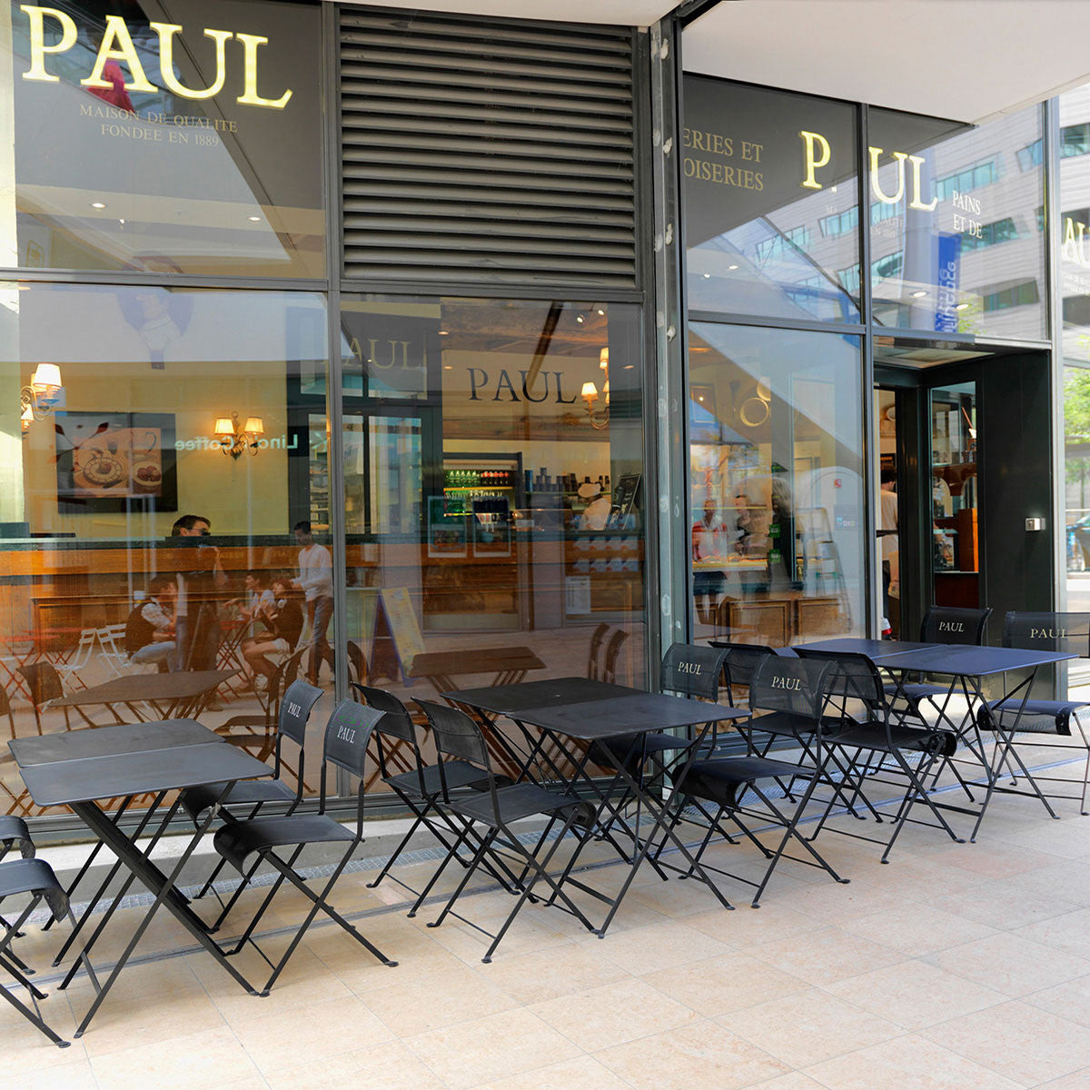 Bistro Table by Fermob, showing live shoot of the table with chairs.