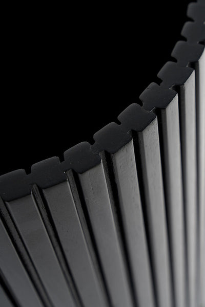 Black Waste Paper Basket by Ethnicraft, showing closeup view of basket.