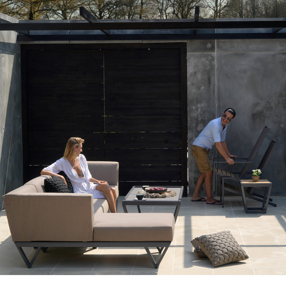 Bondi Adirondack Stackable Casual Chair by Mamagreen, showing bondi adirondack stackable casual chairs with sectional & tables in live shot.