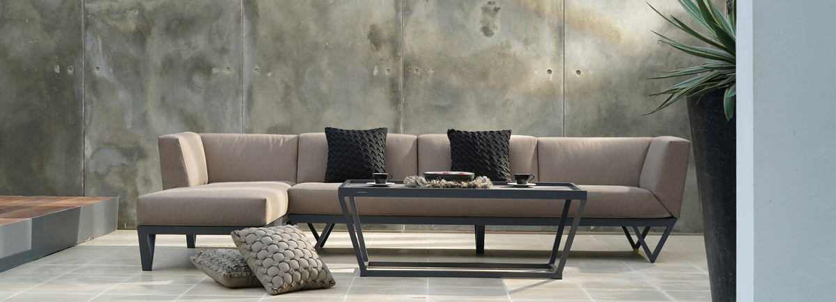 Bondi Rectangular Coffee Table by Mamagreen, showing bondi rectangular coffee table with sectional in live shot.