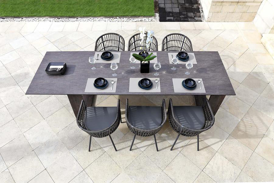 Bono Aluminum Dining Chair by Mamagreen, showing bono aluminum dining chairs with table in live shot.