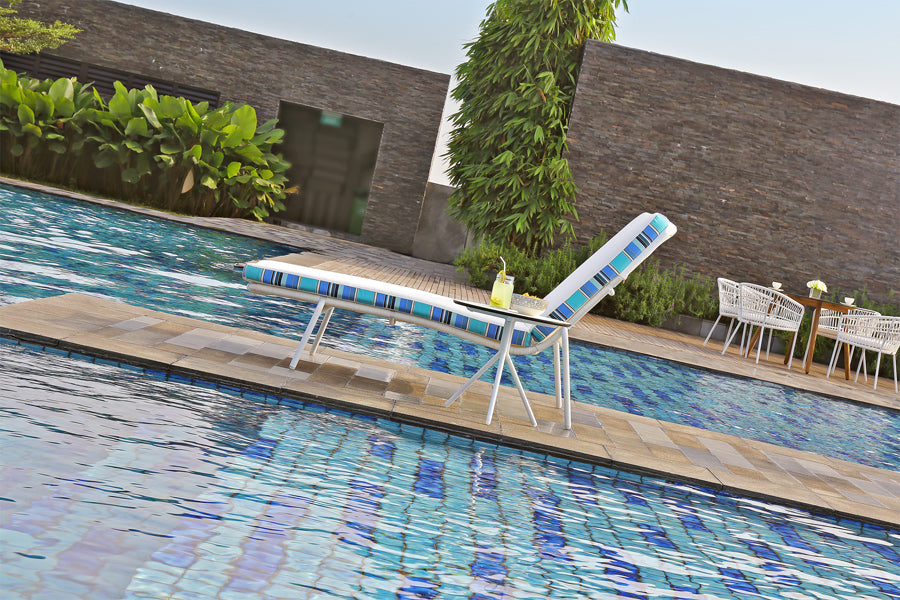 Bono Aluminum Dining Chair by Mamagreen, showing bono aluminum dining chairs with table & sunlounger in live shot.