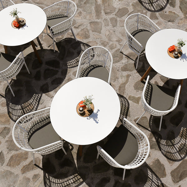 Bono Aluminum Dining Chair by Mamagreen, showing bono aluminum dining chairs with tables in live shot.