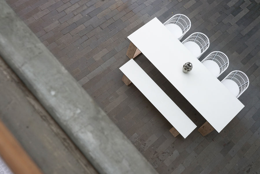 Bono Aluminum Dining Chair by Mamagreen, showing bono aluminum dining chairs with table & bench in live shot.