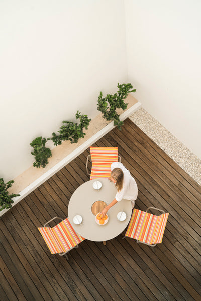 Bono Teak Dining Table by Mamagreen, showing bono teak dining table with dining chairs in live shot.