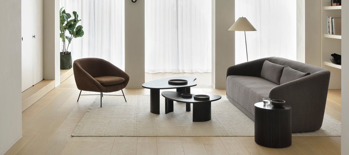 Boomerang Coffee Table by Ethnicraft, showing boomerang coffee tables in live shot.