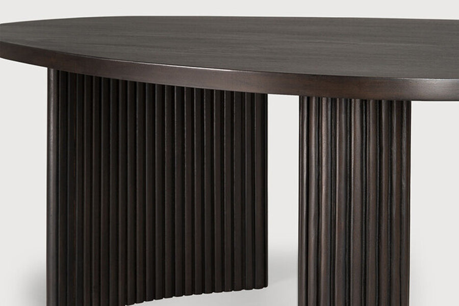 Boomerang Coffee Table by Ethnicraft, showing closeup view of boomerang coffee table in dark brown varnished mahogany.