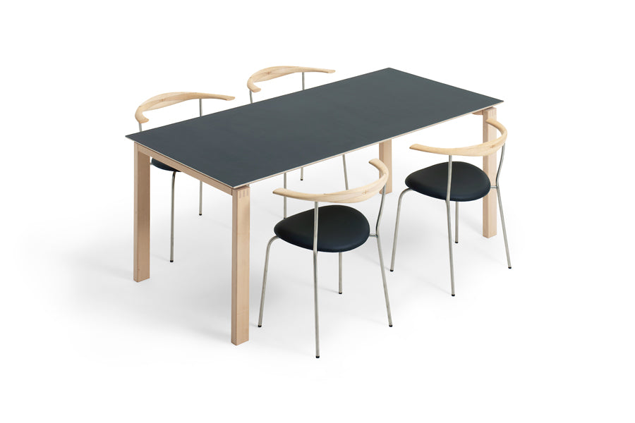 BPS Dining Table No. 175 by Bernh. Pedersen & Son, showing angle view of bps dining table no. 175 in pewter linoleum top with chairs.