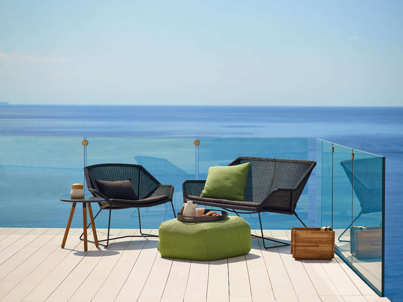 Breeze 2 Seater Lounge Sofa by Cane-Line, showing breeze 2-seater lounge sofa in live shot.