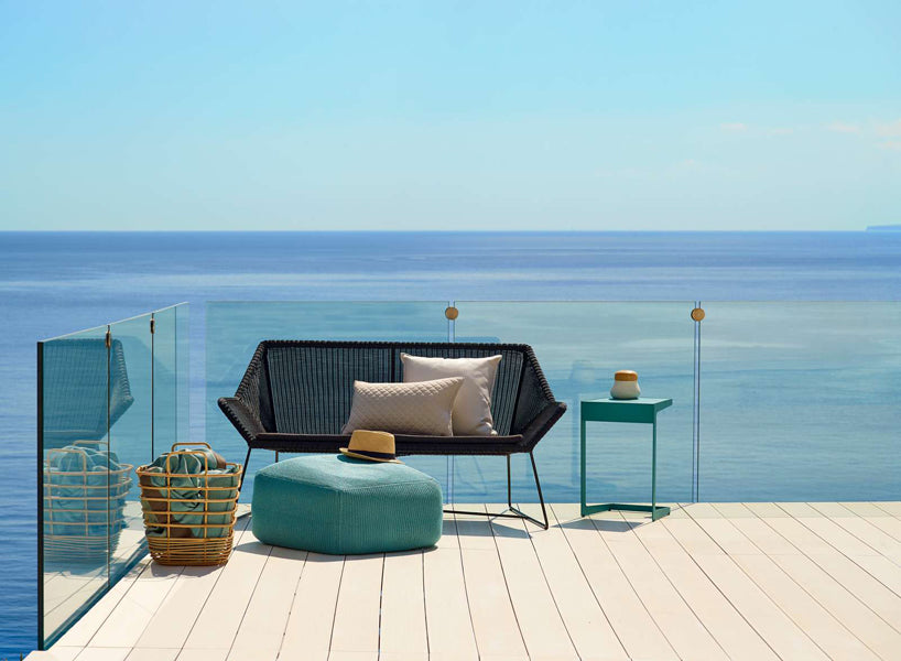 Breeze 2 Seater Lounge Sofa by Cane-Line, showing breeze 2-seater lounge sofa in live shot.