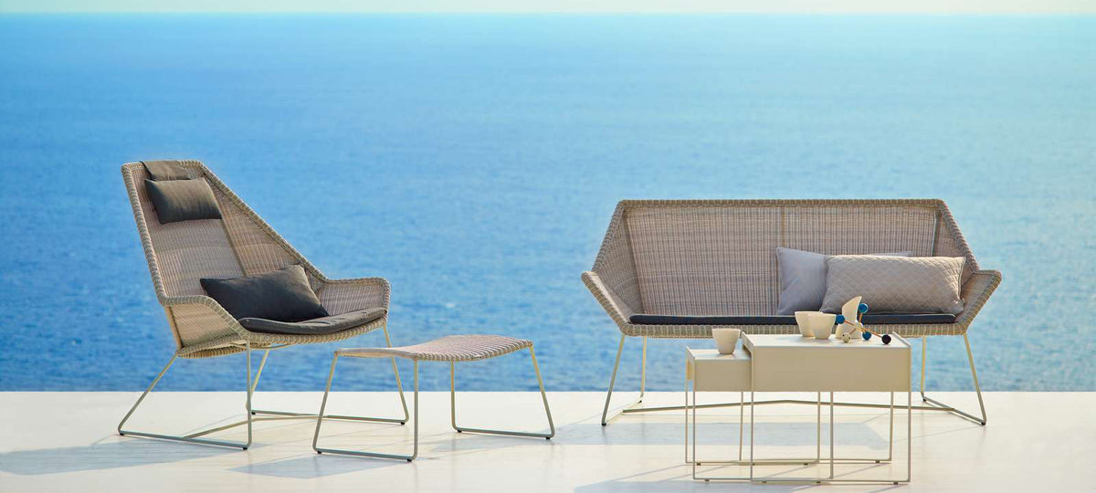 Breeze Footstool by Cane-Line, showing breeze footstool in live shot.