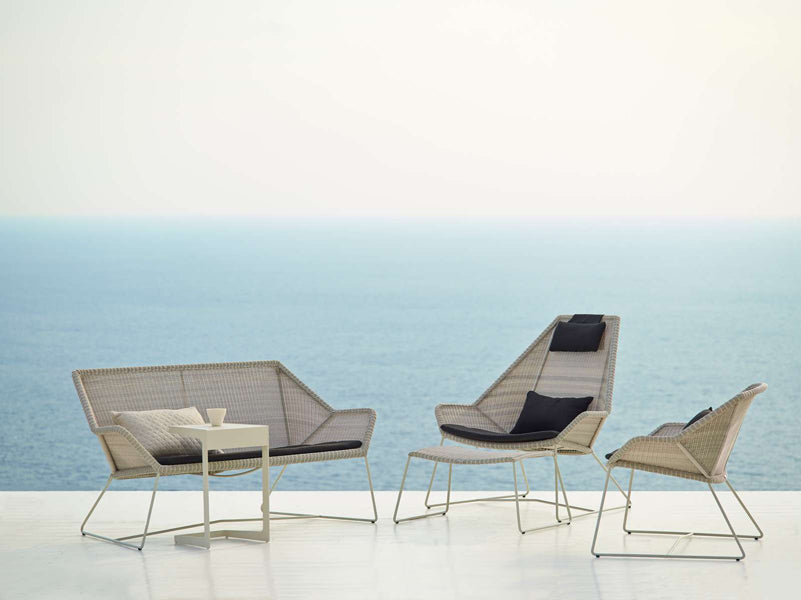Breeze Footstool by Cane-Line, showing breeze footstool in live shot.