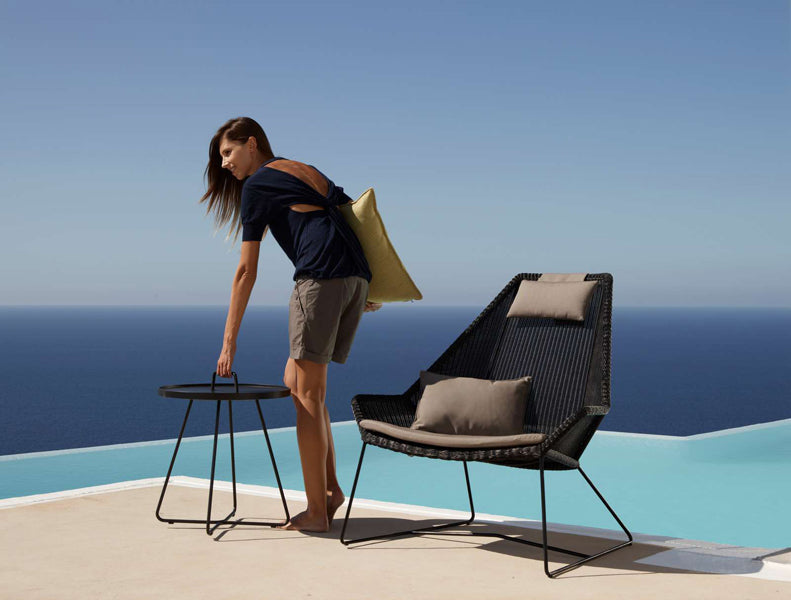 Breeze Highback Chair by Cane-Line, showing breeze highback chair in live shot.