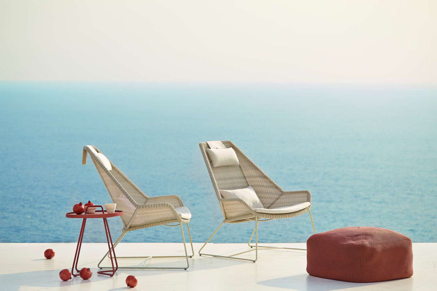 Breeze Highback Chair by Cane-Line, showing breeze highback chairs in live shot.