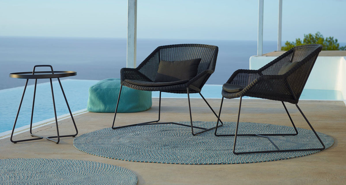 Breeze Lounge Chair by Cane-Line, showing breeze lounge chairs in live shot.