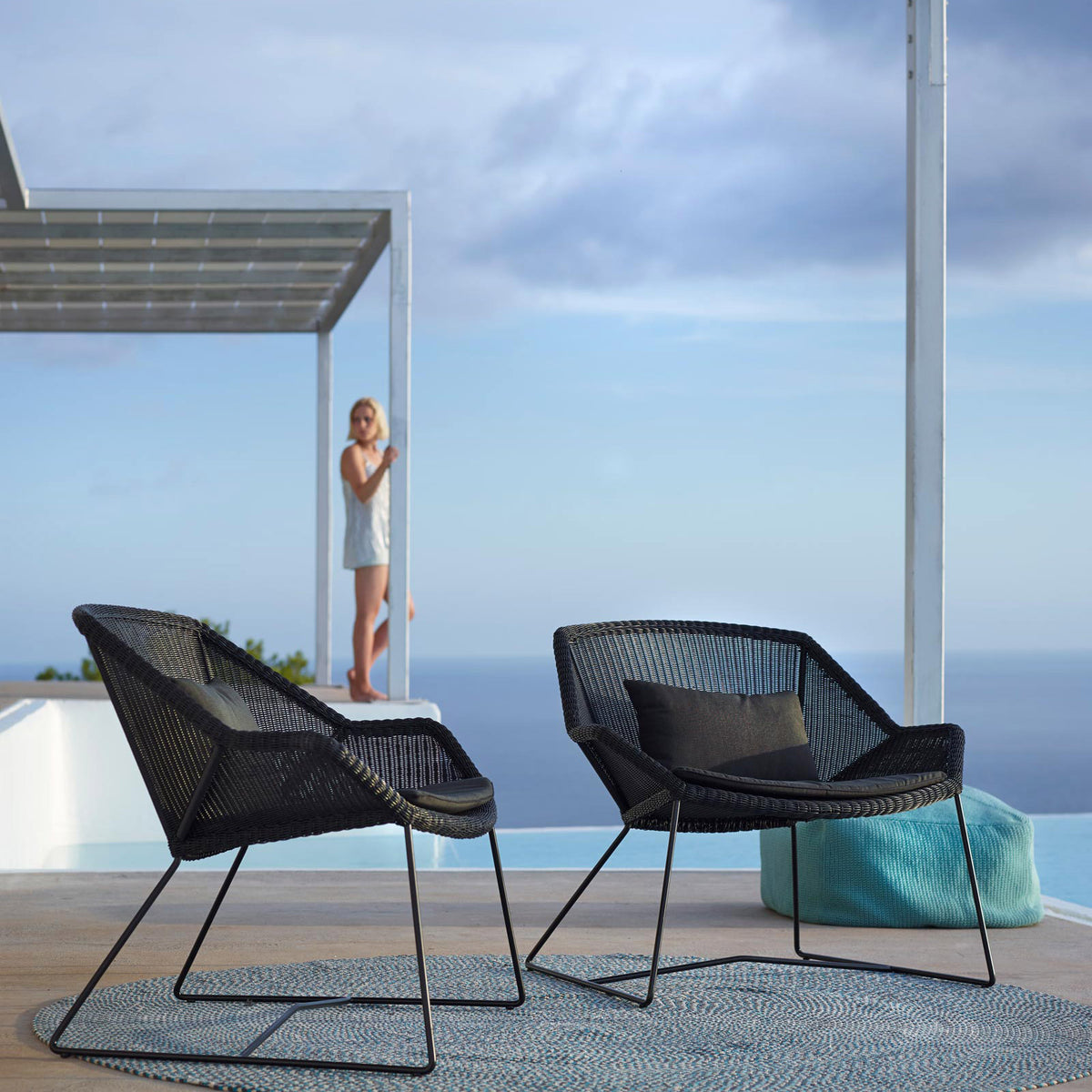 Breeze Lounge Chair by Cane-Line, showing breeze lounge chairs in live shot.